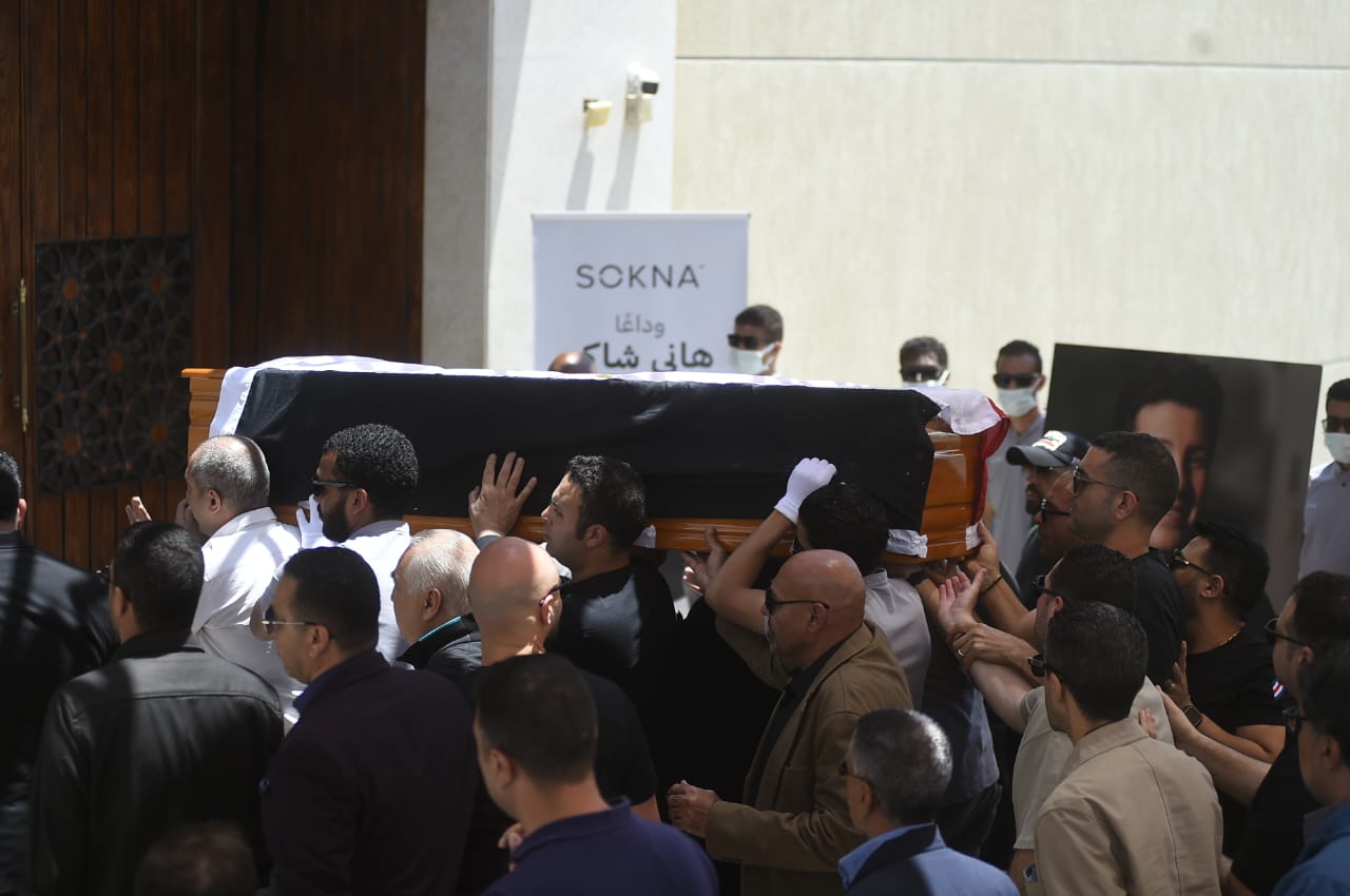 The Egyptian flag was draped around the body of Hani Shaker as it entered the mosque.