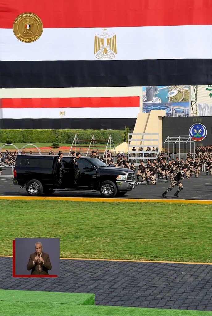 Police Academy cadets navigate fire obstacles and pull a 10-ton armored vehicle during their graduation ceremony.